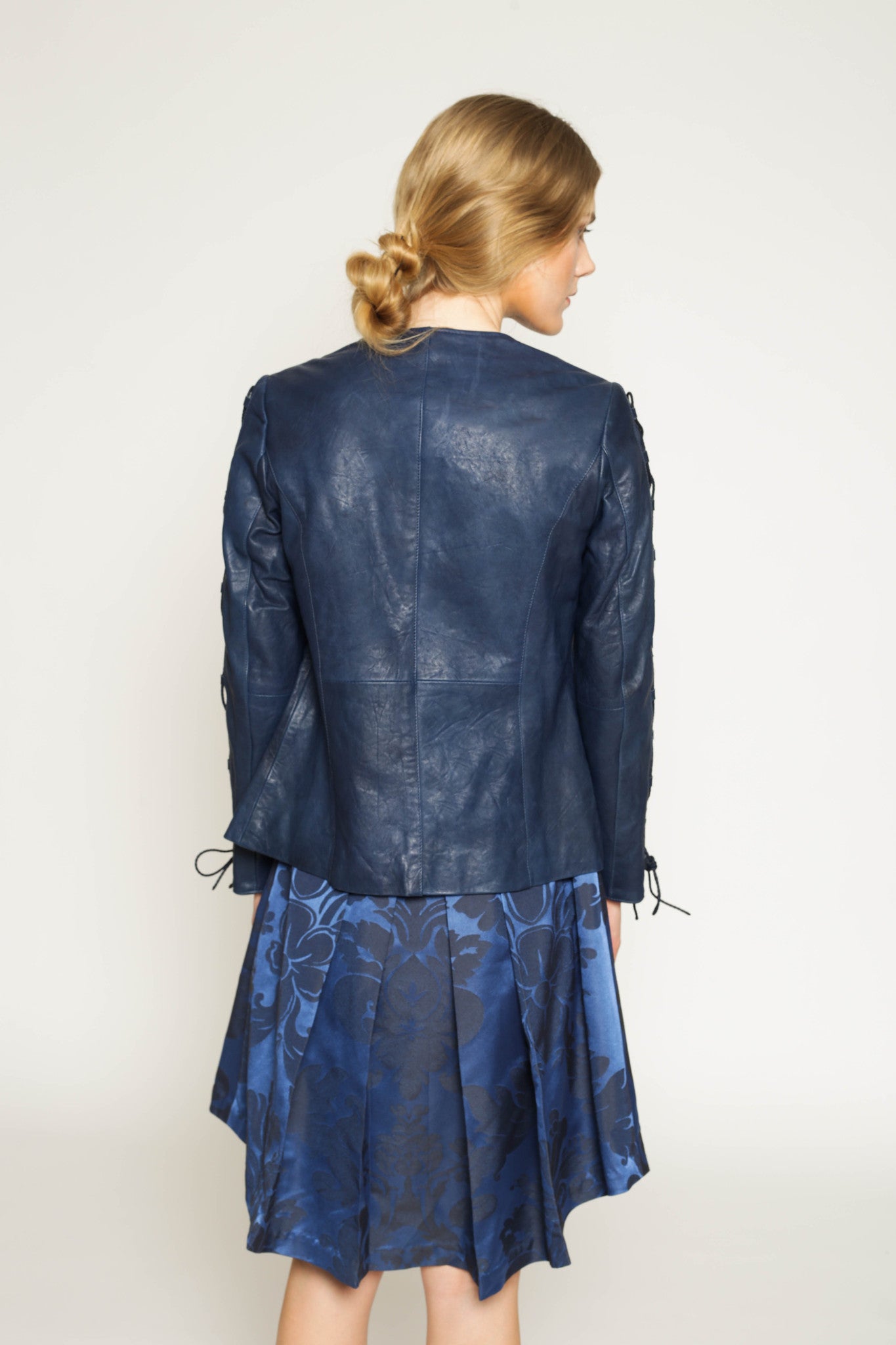 Vegetable dyed leather jacket with lace-up sleeves