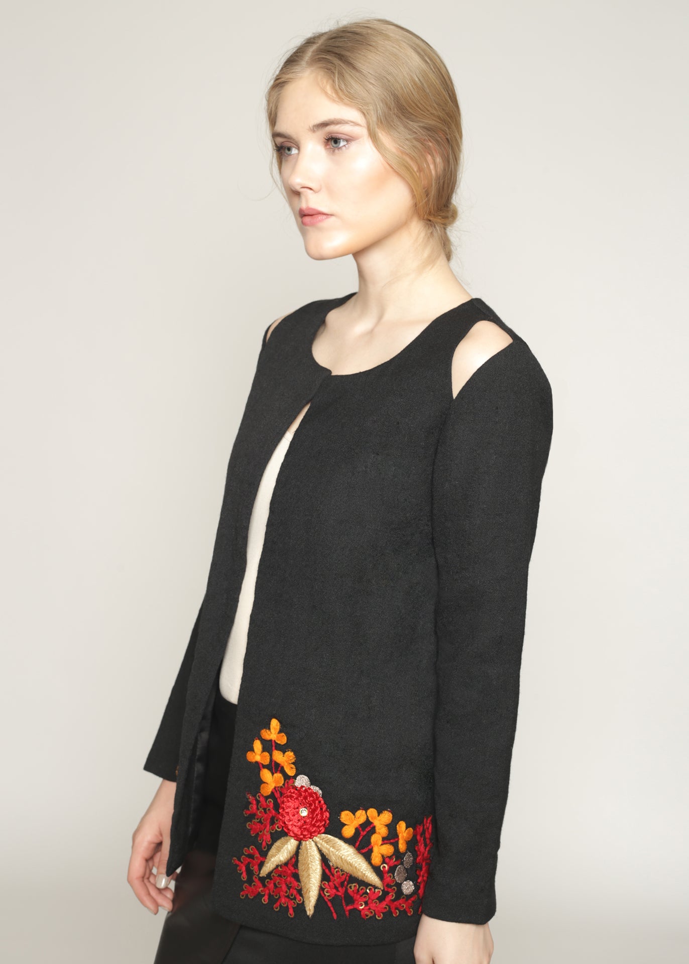 Wool jacket with cutout shoulders and embroidery details