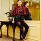 Leather buckled cape with pleated sleeves